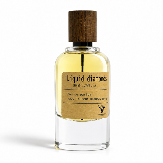 A clear glass LIQUID DIAMONDS perfume bottle with a dark brown wooden cap, filled with pale yellow liquid. It features a brown kraft paper label reading 'Liquid diamonds' and '50ml 1.